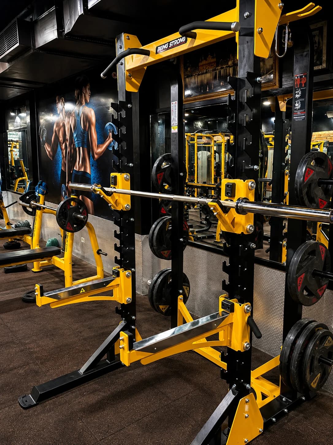 Yellow and graphite strength racks on the Oceanic Gym floor